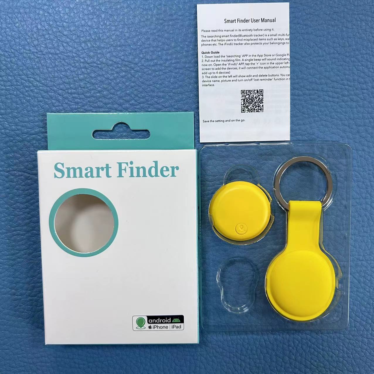 Yellow smart finder device with packaging and user manual on a blue textured background