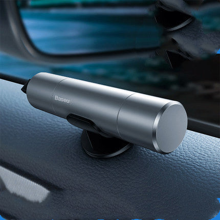 Car lifesaving window breaker tool on a car dashboard