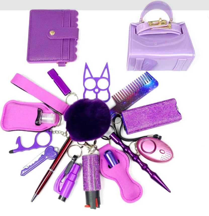close-up of personal safety keychain tools in purple set