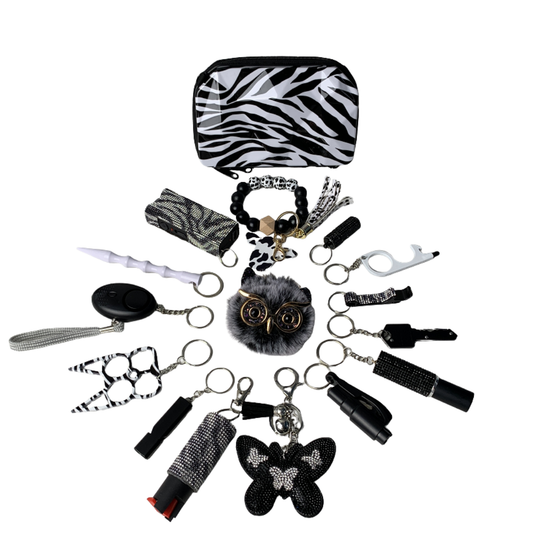 16 piece personal safety keychain set attached to black handbag