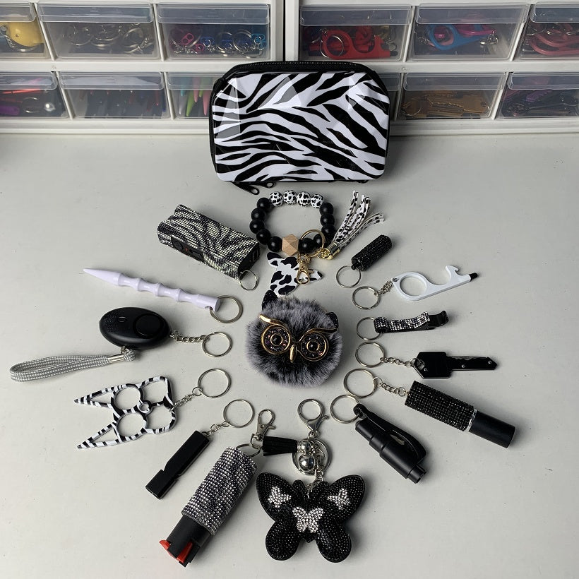 shiny black handbag safety keychain set with self defense tools