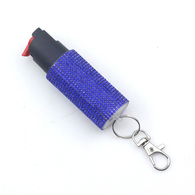 Blue pepper spray with keychain on a white background