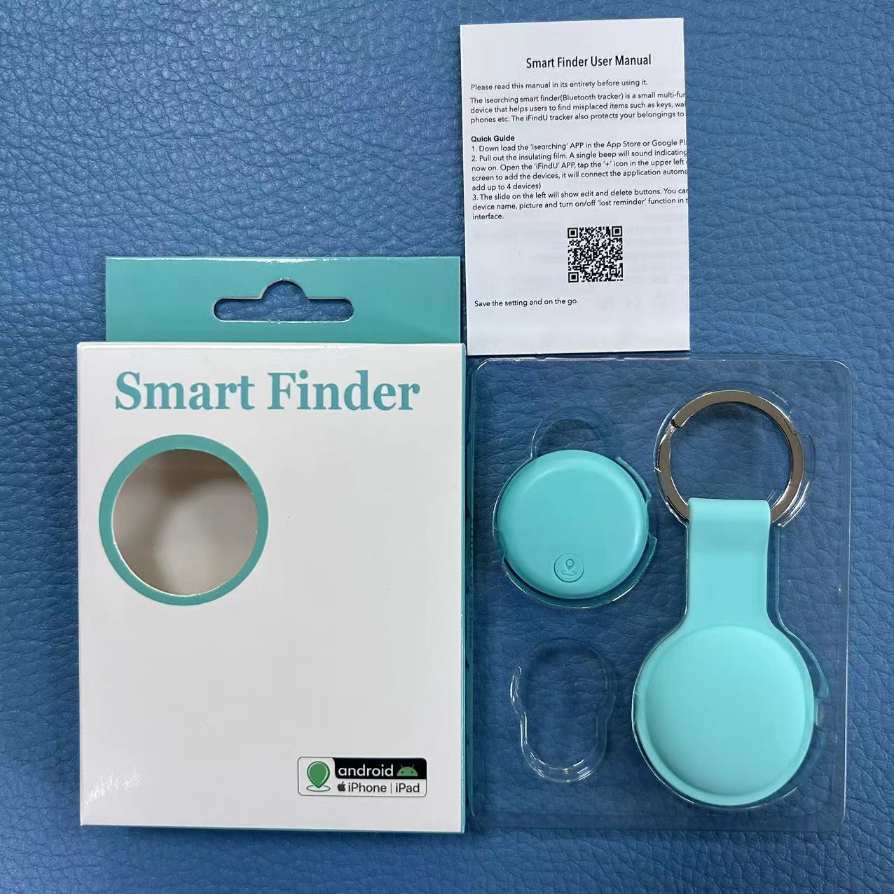 Smart anti-loss Bluetooth tracking device with packaging and user manual on a blue textured background