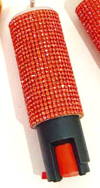 Red pepper spray with rhinestone casing on a white background