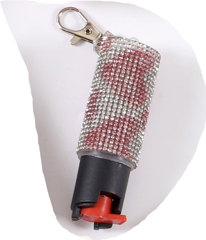Decorative pepper spray with rhinestone cover on a white background