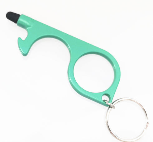 A mint green personal safety keychain tool with a thumb stud, bottle opener, and small black tip, attached to a silver metal key ring on a white background.