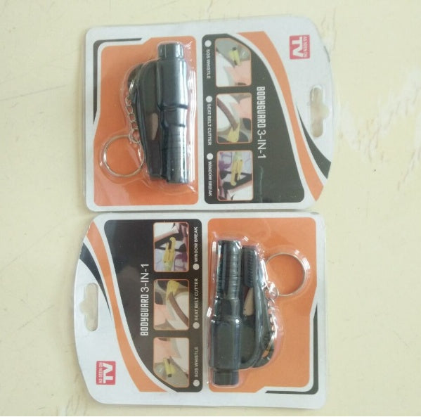 Two packages of a 3-in-1 car  window breaker with keychain on a beige background
