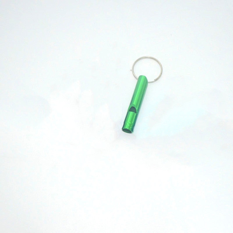 Green keychain rescue whistle on a white background