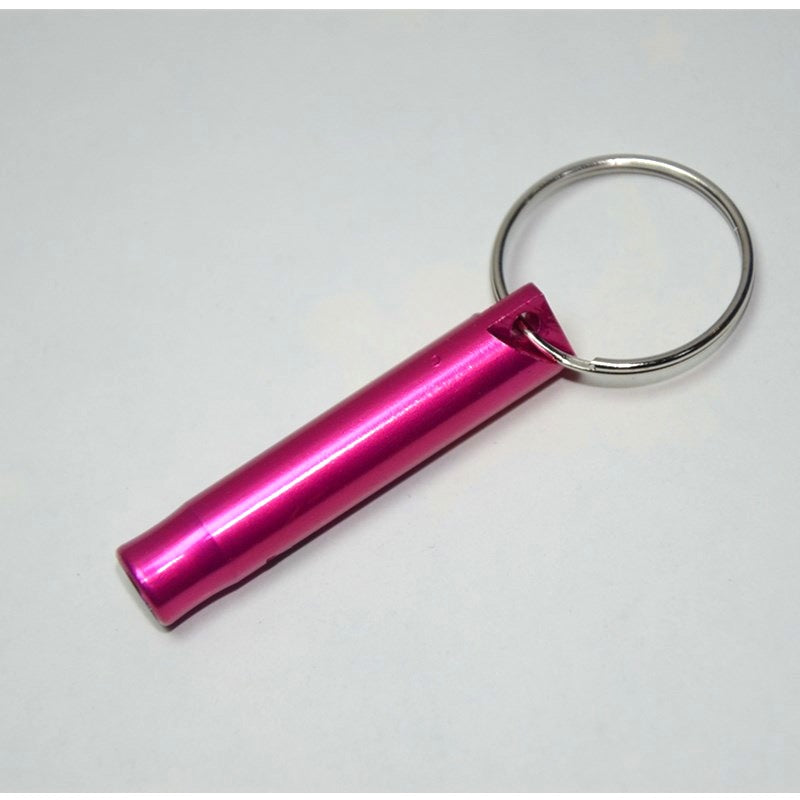 Pink cylindrical keychain rescue whistle on a white background