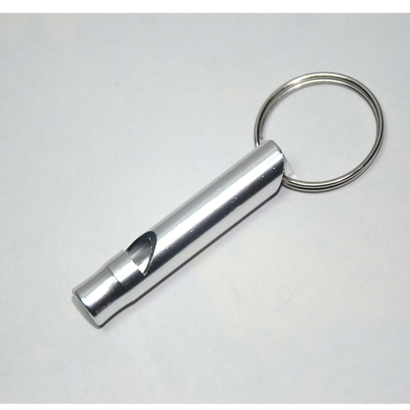 Metallic keychain rescue whistle on a white background