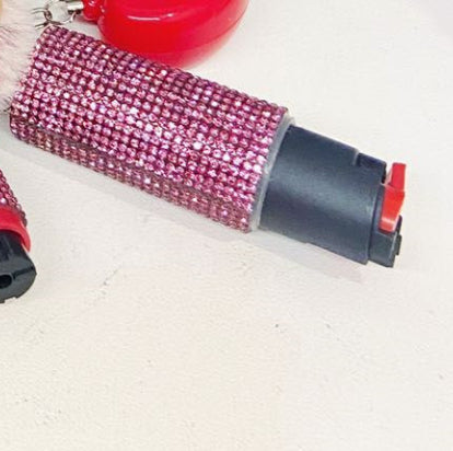 Pink pepper spray on a white surface