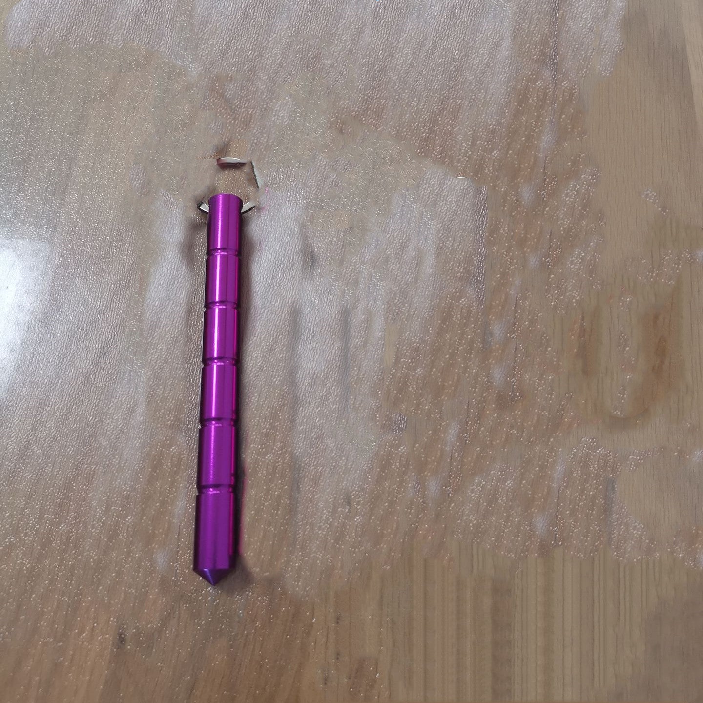 Compact aluminum safety tool attached to a keychain