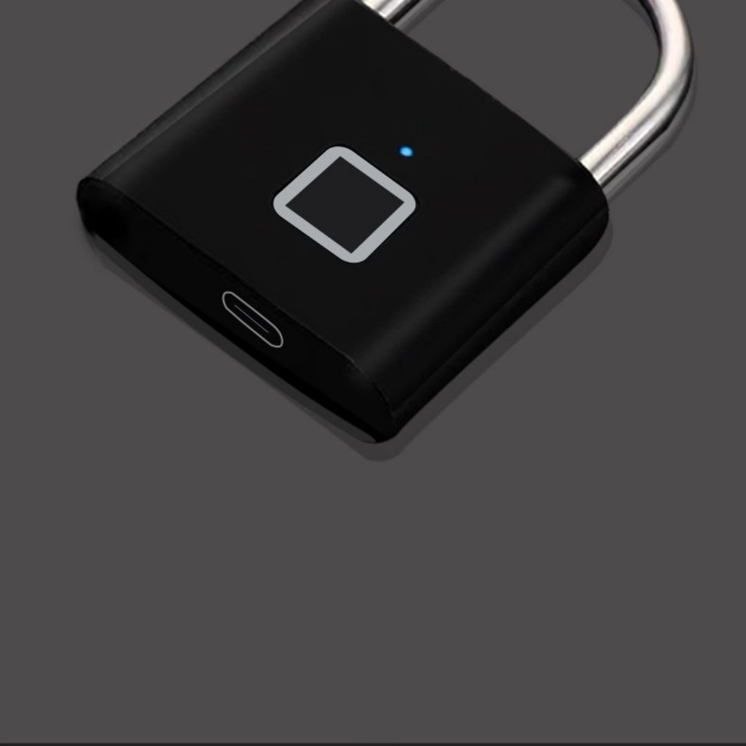Black luggage and secure padlock with fingerprint sensor on a gray background