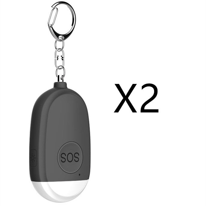 Black keychain device with SOS button and carabiner on a white background