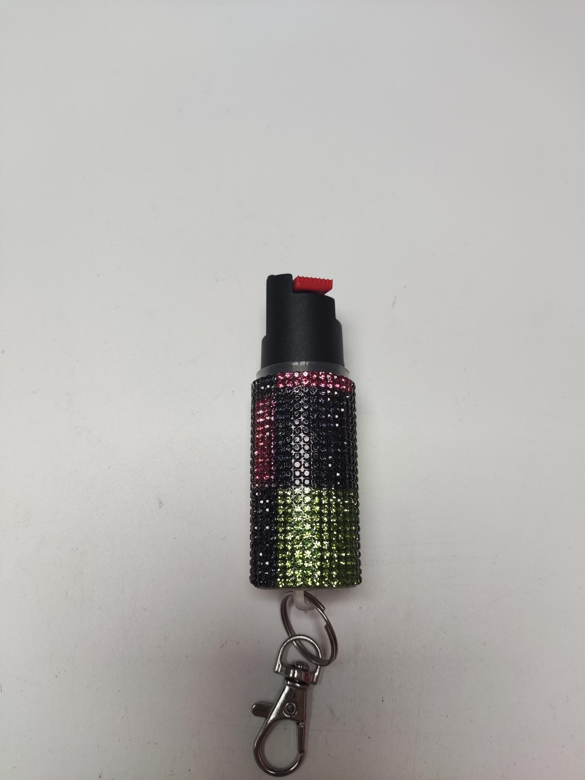 Gradient-colored pepper spray case with keychain on a white background