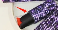 Pepper spray with purple glittery background