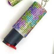 Multicolored beaded keychain with a cylindrical object on a white background