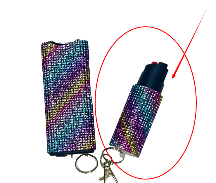 Multicolored pepper spray with keychain on a white background