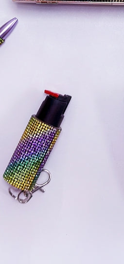 Multicolored beaded pepper spray case on a white background