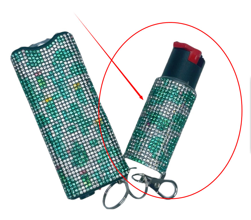 Two pepper spray canisters with bling, one open showing red contents.