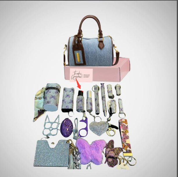 Collection of accessories including a handbag, keychains, and pouches on a light gray background.